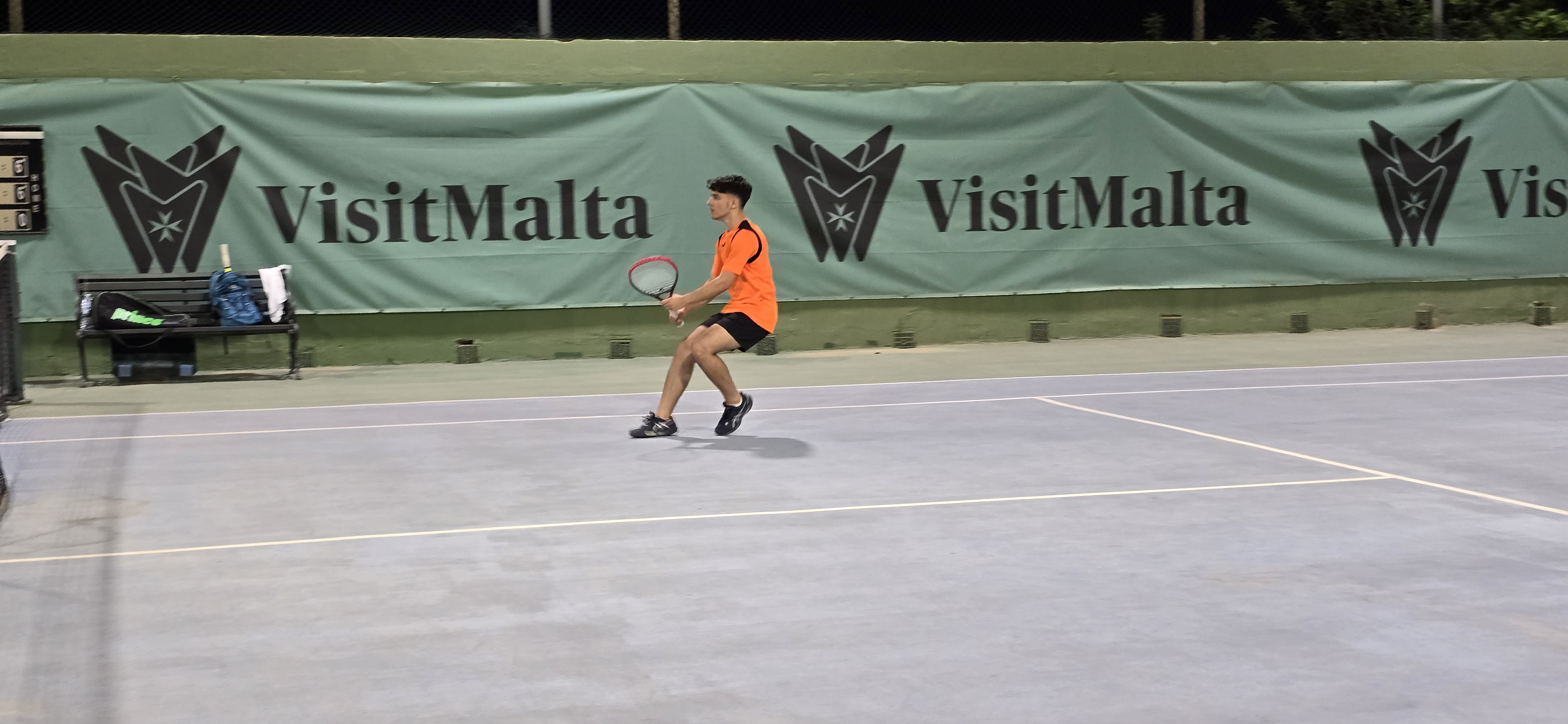 Tennis player in action on court